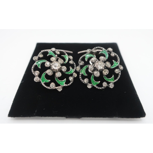 104 - Pair of unmarked paste and green enamel openwork buttons, now with silver stamped oval backs (2)