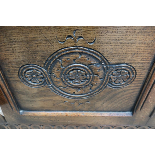30 - 17th C style oak low side cabinet, with overhanging top, and scroll carved frieze above two lozenge ... 