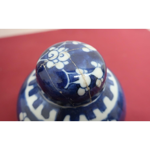 65 - Japanese baluster vase, decorated in blue and white with prunus blossom, cover with dog of Fo finial... 