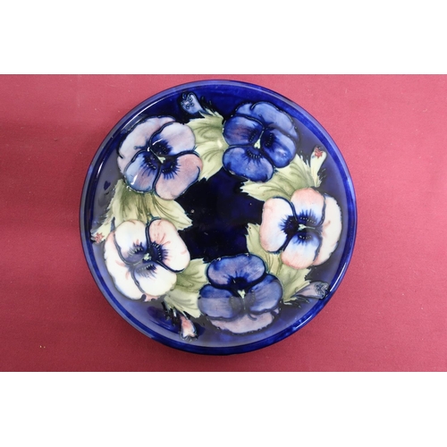 66 - Moorcroft circular shallow dish, decorated with poppies on a blue ground impressed and similarly sig... 