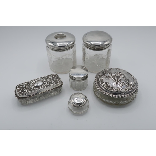 87 - Collection of Victorian and later hallmarked silver topped dressing table jars (H7.5 cm) max, London... 