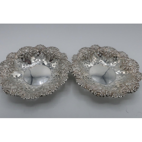 92 - Pair of Edwardian hallmarked silver circular sweetmeat dishes, pierced and repousse with foliage, Ch... 