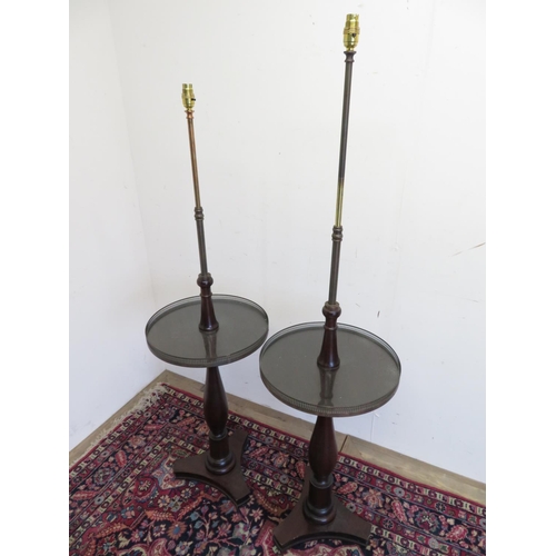 108 - Pair of Regency style mahogany standard lamps with adjustable brass columns above galleried circular... 