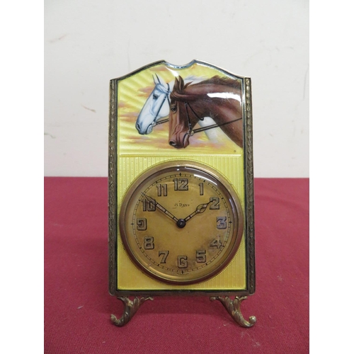 14 - Enamel and silver gilt faced 8 day mantel clock with pair of horses heads on yellow enamel backgroun... 