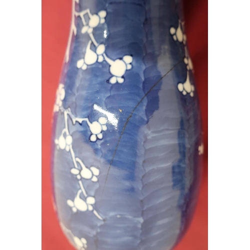 65 - Japanese baluster vase, decorated in blue and white with prunus blossom, cover with dog of Fo finial... 