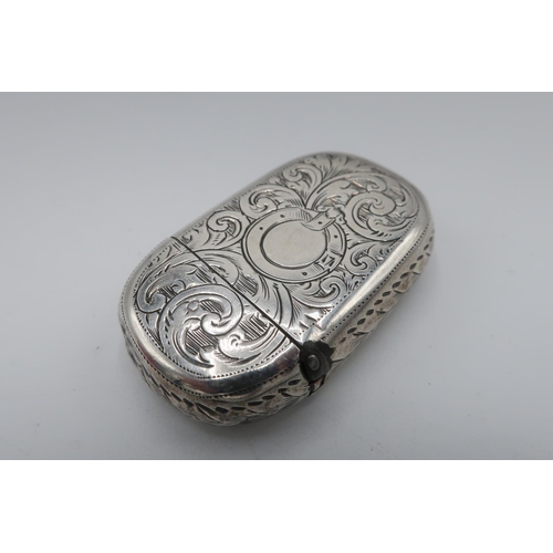 86 - Victorian hallmarked silver rounded rectangular vesta, engraved with scrolls, Birmingham 1867 and a ... 