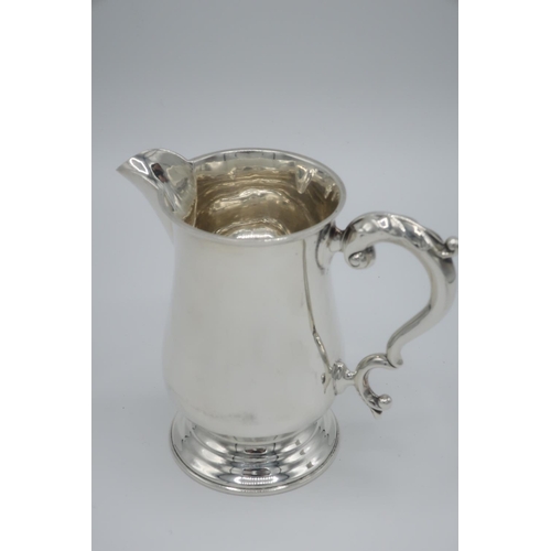 97 - Geo. lll style hallmarked silver cream jug with S scroll handle, London 1911, four variously hallmar... 