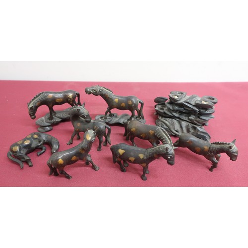 82 - Collection of eight Chinese bronze models of horses with glass eyes, in various stances, on carved w... 