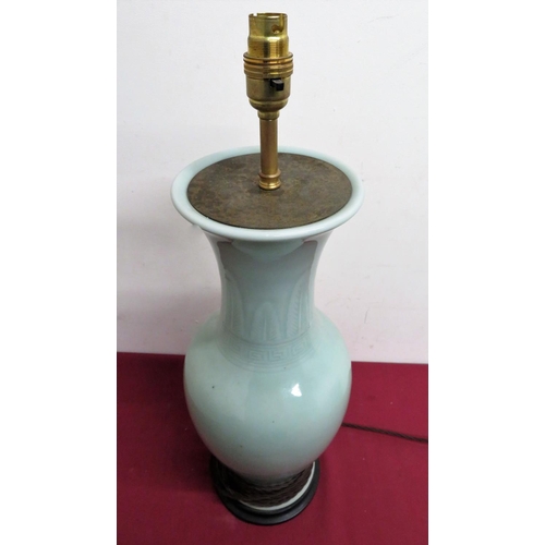 310 - Chinese pale green glaze Celadon type vase converted to a electric table lamp, on turned ebonised ba... 