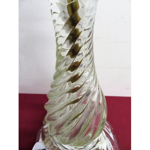 343 - Heavy moulded glass spiral twist electric table lamp on four paw shaped feet (H45cm)