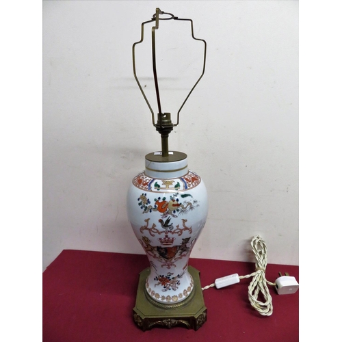 344 - Armorial ceramic vase converted to electric table lamp with elaborate brass base (cracks to rim) (H6... 