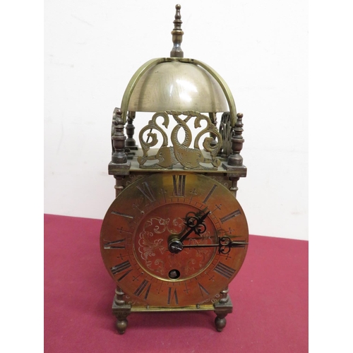 346 - Brass lantern striking clock with turned top final, stamped Astral of Coventry 23751 (H28cm)