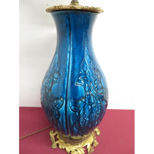 353 - Large relief moulded baluster blue glazed three light table lamp, gilt metal top cast with grape vin... 