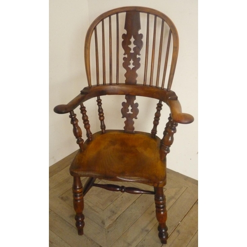 52 - 19th C yew and elm broad arm Windsor elbow chair, with pierced shaped splat, out scrolled arms and s... 