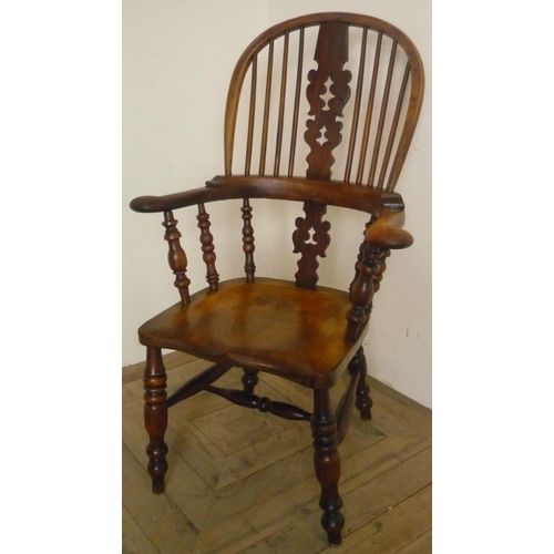52 - 19th C yew and elm broad arm Windsor elbow chair, with pierced shaped splat, out scrolled arms and s... 