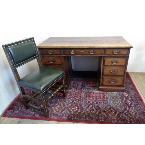 75 - Titchmarsh and Goodwin cabinet makers of Ipswich: an oak twin pedestal desk, moulded rectangular top... 