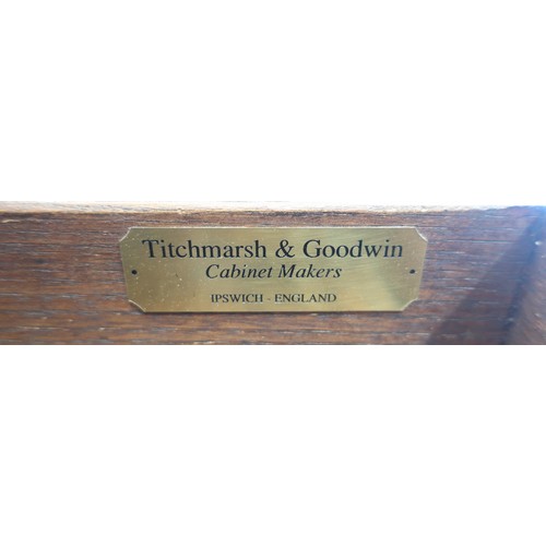 75 - Titchmarsh and Goodwin cabinet makers of Ipswich: an oak twin pedestal desk, moulded rectangular top... 