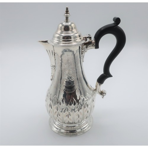 338 - Geo. lll hallmarked silver coffee pot, baluster body relief decorated with leafage and crest, unmark... 