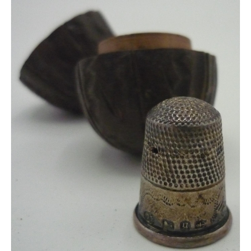 162 - Victorian silver hallmarked thimble, Birmingham 1881, in a case carved as a nut, two sterling silver... 