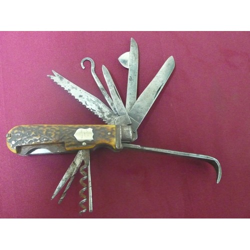 11 - Late 19th C 'Game Keepers' pocket knife with 13 tools and 16 functions and twin antler grips. An ins... 