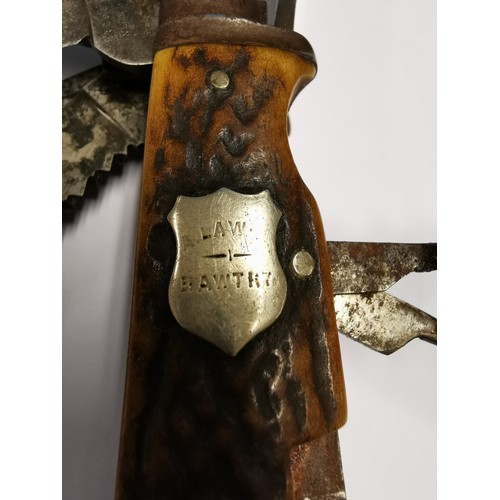 11 - Late 19th C 'Game Keepers' pocket knife with 13 tools and 16 functions and twin antler grips. An ins... 
