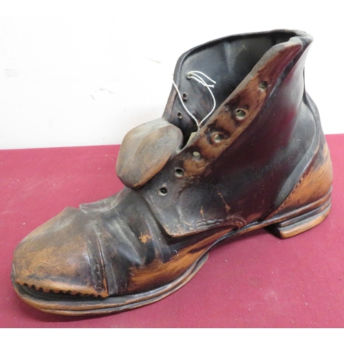 235 - Urbanware pottery model of a boot with scuffed black finish. (H5cm x L6cm)