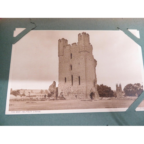 101 - Album containing coloured and real photographic topographical views postcards of the Isle of Man, We... 