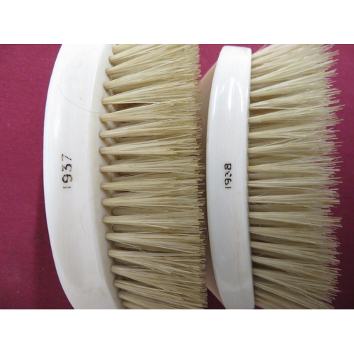 268 - Pair of ivory monogrammed hairbrushes dated 1937 and 1938, (2)