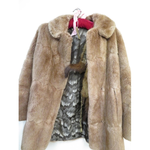 299 - Ladies mink coat with silk lining, another fur coat and and two fox stoles.