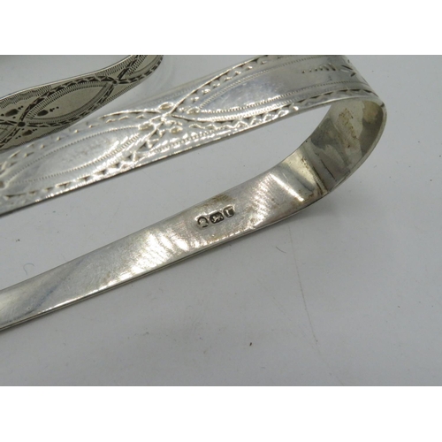36 - Pair of Georgian silver hallmarked bright cut sugar tongs by Peter and Ann Bateman, and a similar pa... 