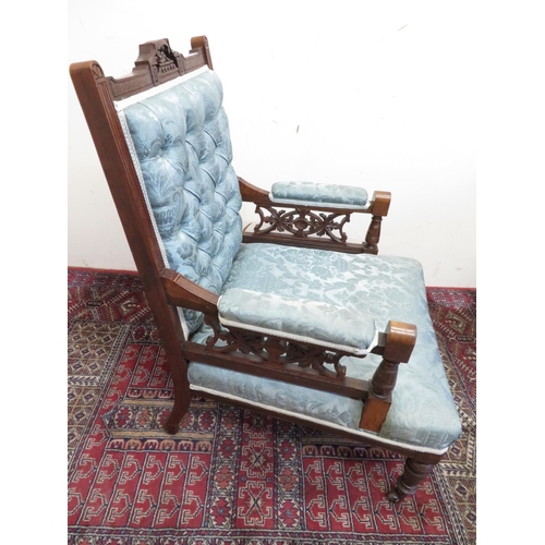 360 - Edwardian walnut framed salon armchair with deep button upholstered back and carved pierced arms on ... 