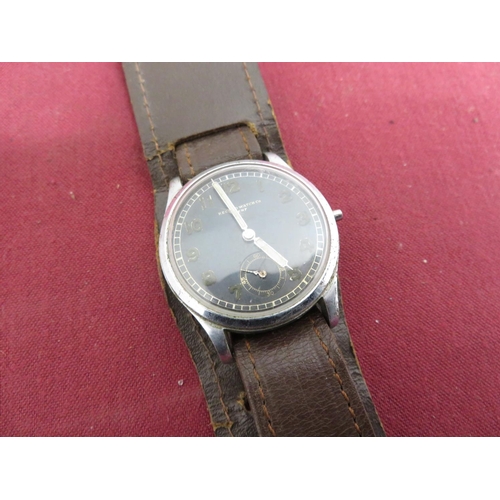 99 - Record Watch Co military type wristwatch, stainless steel case on leather strap, case back stamped D... 