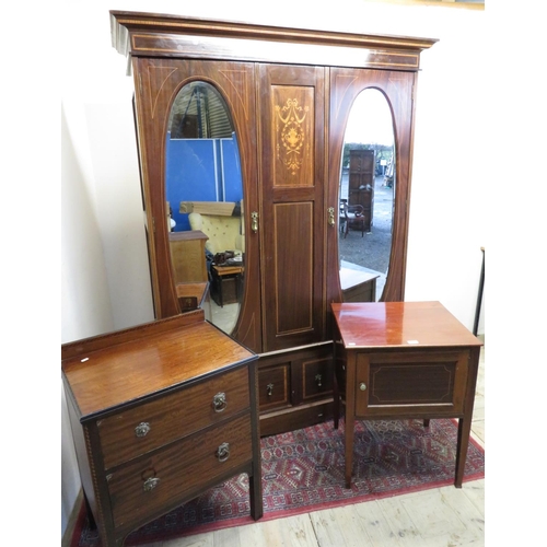 313 - Edwardian inlaid mahogany wardrobe enclosed by a pair of mirror doors above two drawers on plinth ba... 