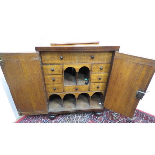 378 - Small early Victorian mahogany cabinet, the oak interior fitted with drawers and compartments enclos... 