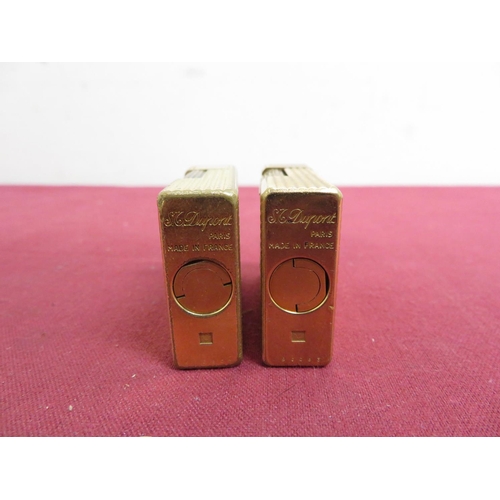 489 - Two DuPont gold plated pocket cigarette lighters, textured design (H4.5cm) stamped A9CC83 and K9CR08... 