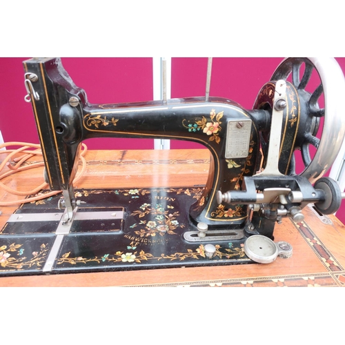 259 - Barwick & Haggas, Keighley 'Criterion' treadle sewing machine with belt, cast iron base with inlaid ... 