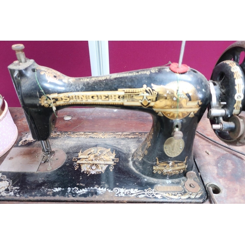 332 - Singer treadle sewing machine with cover, on cast iron base, No.1331932SS. (W110cm x 80cm)