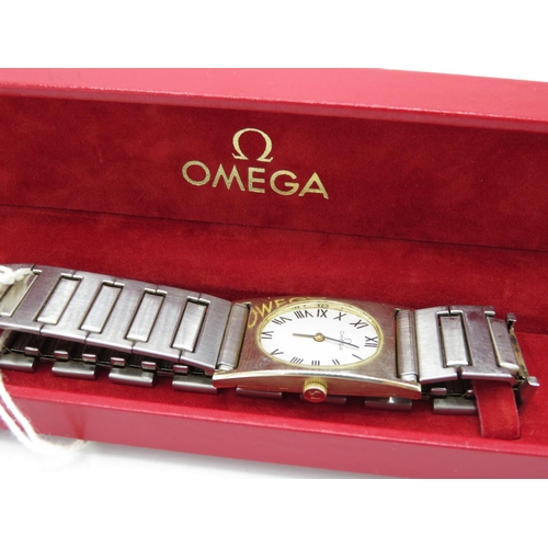 507 - Omega lady’s hand wound wristwatch. Gold plated rectangular case with oval dial aperture. Case back ... 