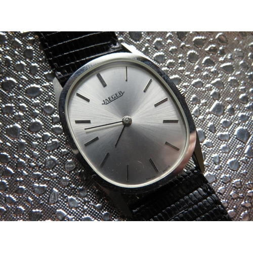 518 - Jaeger hand wound wristwatch. Stainless steel case on leather strap. Case back No 3516-42 & 280. Gil... 