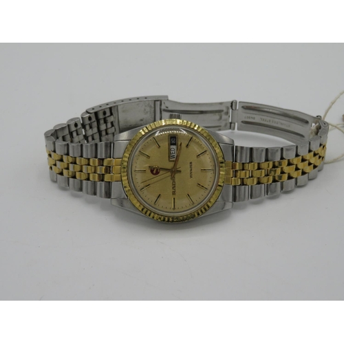 527 - Rado Voyager automatic wristwatch with day date.  Stainless steel and gold-plated case with matching... 