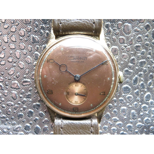 550 - Charles Nicolet Tramelan hand wound wrist watch. 18ct gold case hallmarked and numbered 208-19