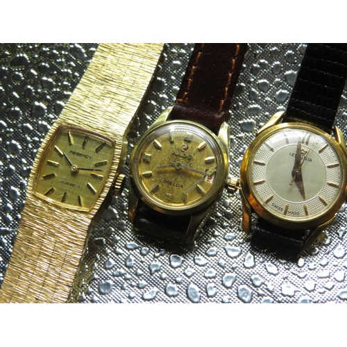 558 - Lemania lady's hand wound wristwatch.  Gold plated case on leather strap. Rado Imelda lady's hand wo... 