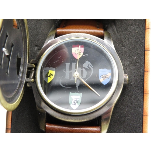 569 - Harry Potter Quatrz wristwatch, original tin lacking lid, Corus Mickey mouse quartz wristwatch, Quar... 