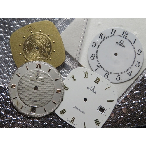 578 - Three Omega watch dials and a Corus watch dial