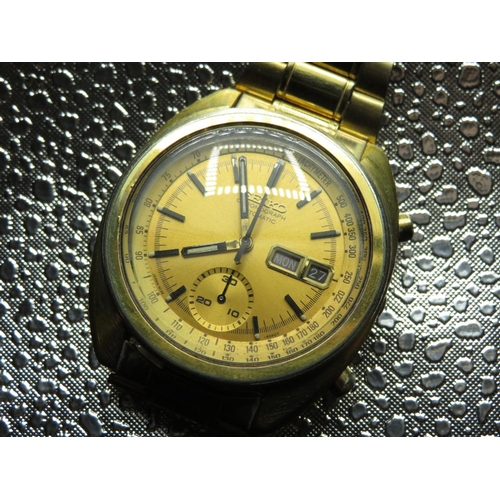 592 - Seiko automatic chronograph with day date. Gold plated case on gold plated bracelet. Case back stamp... 