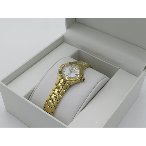 596 - Seiko Coutra lady's quartz wristwatch with date. Gold plated case on matching bracelet. Case back st... 