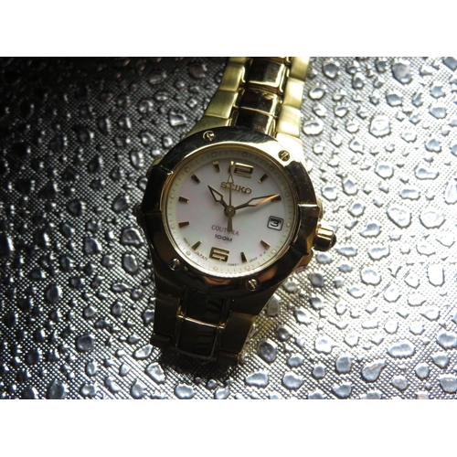 596 - Seiko Coutra lady's quartz wristwatch with date. Gold plated case on matching bracelet. Case back st... 