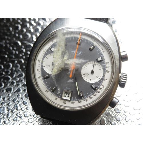 609 - Heuer hand wound chronograph wristwatch with date. Stainless case on leather strap. Case back number... 