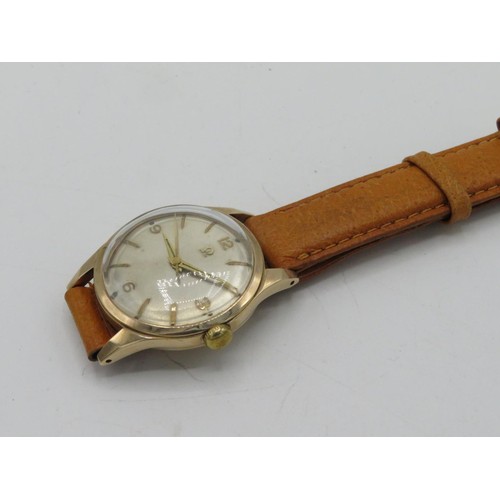 610 - Omega hand wound wristwatch. 9ct gold case on leather strap. Case back stamped Omega Watch Co. 9ct c... 