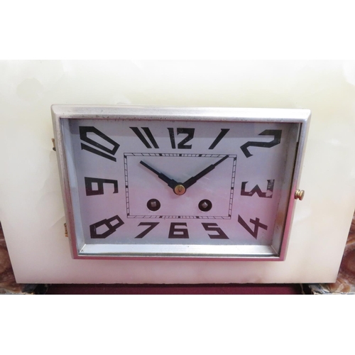 14 - Art Deco coloured marble and alabaster three piece clock garniture with silvered Arabic dial, and se... 